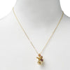 Flower necklace pendant  in yellow gold plating on mannequin display from Forest Jewelry singapore