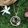 necklace pendant in rose gold plating with butterfly in crystals from forest jewelry on grass