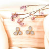 a pair of trillium spring flowers stud earrings made with leather in dusty grey set in yellow gold plating from forest jewelry singapore