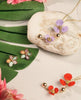 blooms flora stud earrings with flora necklaces on table from forest jewelry singapore