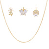 Gold jewelry set with butterfly, flora and clover shaped earrings and a necklace on a white background