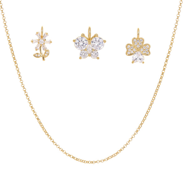 Gold jewelry set with butterfly, flora and clover shaped earrings and a necklace on a white background