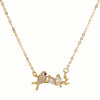 Gold necklace with bird design on a white background