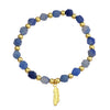 Bracelet with aquamarine and gold beads on a white background