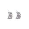 Pair of silver earrings with clear stones on a white background