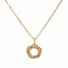 Gold necklace with a circular pendant on a white background