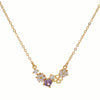 Gold necklace with floral and shell details on a white background
