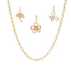 Gold chain necklace with butterfly pendants on a white background