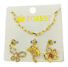 Gold jewelry charm necklace on a 'FOREST' branded card
