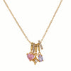 Gold necklace with pink and purple crystals pendant on a white background