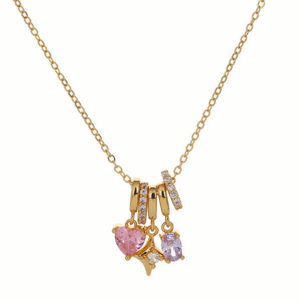 Gold necklace with pink and purple crystals pendant on a white background