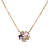 Gold necklace with a heart-shaped clover pendant featuring purplecrystals on a white background