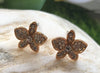 a pair of orchid rose gold plated stud earrings with crystals on stone from forest jewelry singapore