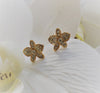 a pair of orchid rose gold plated stud earrings with crystals from forest jewelry singapore