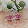a pair of petite light purple dendrobium orchid stud earrings in rose gold plating from forest jewelry singapore