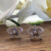 a pair of purple dendrobium orchid stud earrings in rhodium plating from forest jewelry singapore