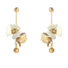 a pair of dangling gold plated flora flower earrings in white daisy form forest jewelry singapore