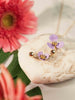 necklace pendant in yellow gold plating with lavender flower petals from Forest Jewelry singapore on stone