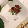 necklace pendant with jasmine petals made from mother of pearl in rhodium plating on book from forest jewelry singapore