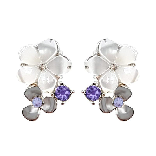 a pair of jasmine earrings with petals made from mother of pearls in rhodium plating from forest jewelry singapore
