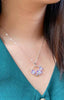 necklace pendant with 2 tone orchid and leaf in purple violet and white set in rhodium plating on neck from forest jewelry singapore