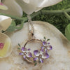 necklace pendant with 2 tone orchid and leaf in purple violet and white set in rhodium plating on stone from forest jewelry singapore