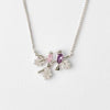 necklace pendant with birds in pink and purple crystals on twig and leaves set in rhodium plating from forest jewelry singapore
