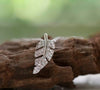 leaf stud earring with crystals in rhodium plating from forest jewelry