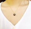black onyx pendant around model neck from forest jewelry singapore