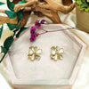 yellow gold plated ear studs with gold and white petals from forest jewelry