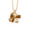 necklace pendant in yellow gold plating with gold and mustard yellow petals from forest jewelry white background