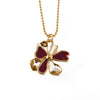 necklace pendant in yellow gold plating with gold and red petals from forest jewelry white background