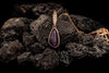 pendant in rose gold plating with crystals and amethyst semi precious gemstone on stones from forest jewelry